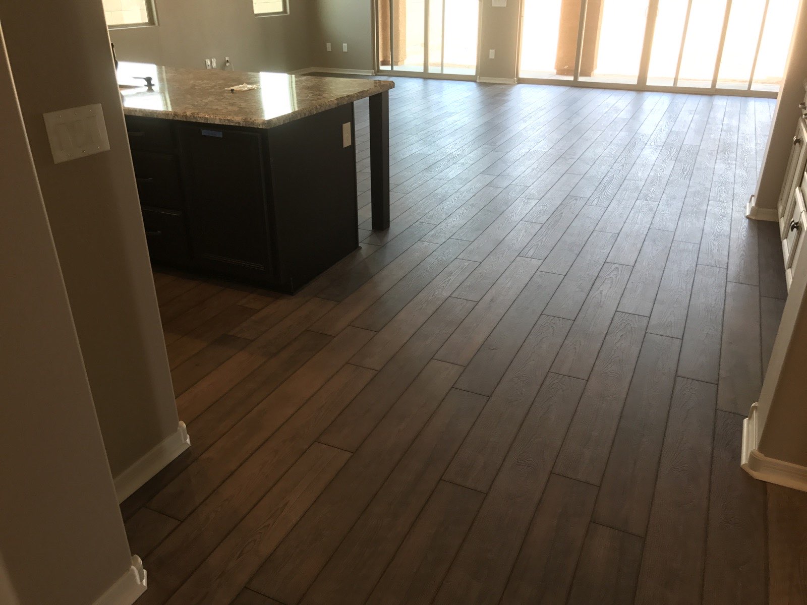 Wood-look plank flooring installation during remodel